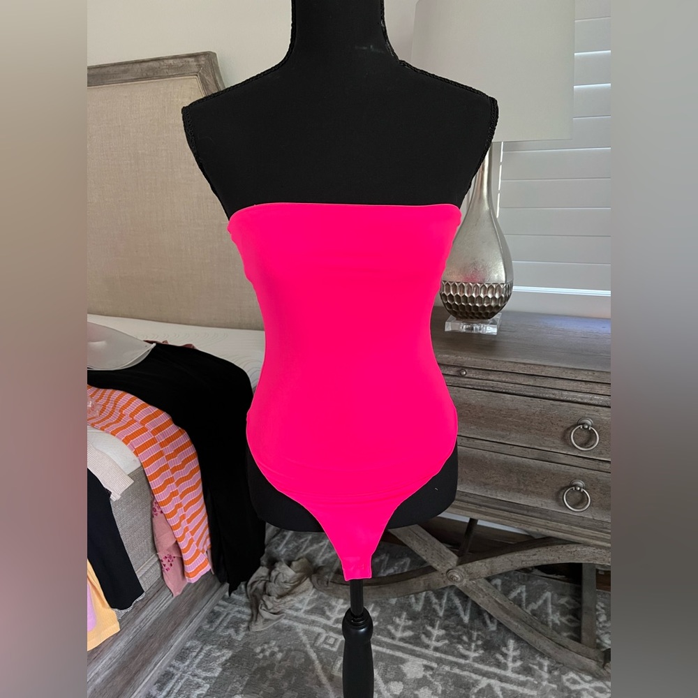 Hot pink body suit